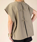 Blouse with bows on the back